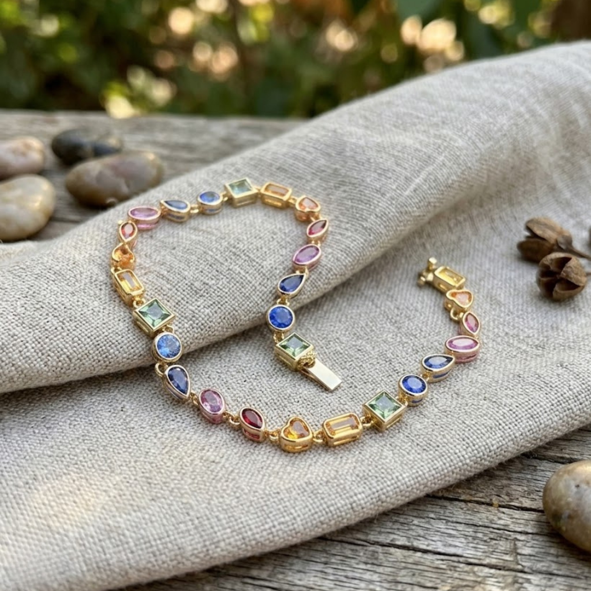 Colorful gemstone bracelet available in white, yellow and rose gold.