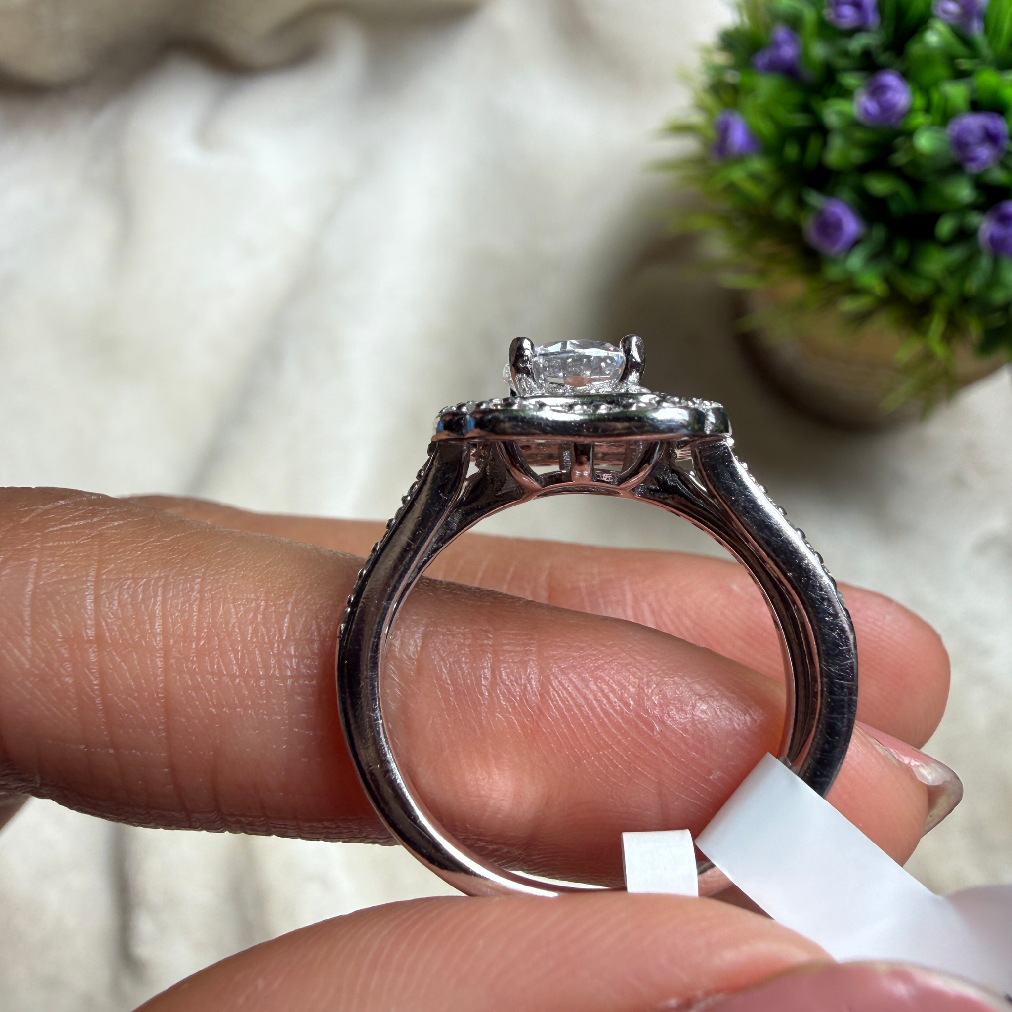 Round halo lab-grown diamond engagement ring in white gold by Kiashaa Jewellery.