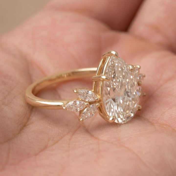 Made-to-order pear diamond bridal ring with six marquise accents