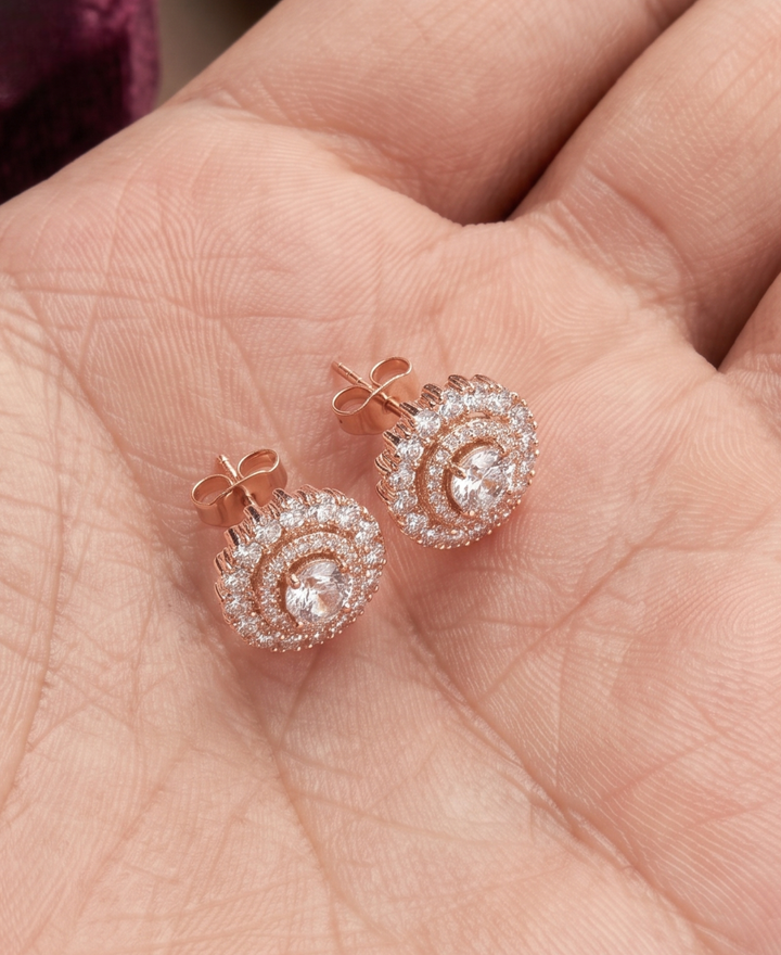 Classic halo diamond stud earrings available in White Gold, Yellow Gold and Rose Gold.