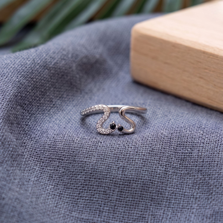 Romantic open ring featuring two swans forming a heart-shaped design.