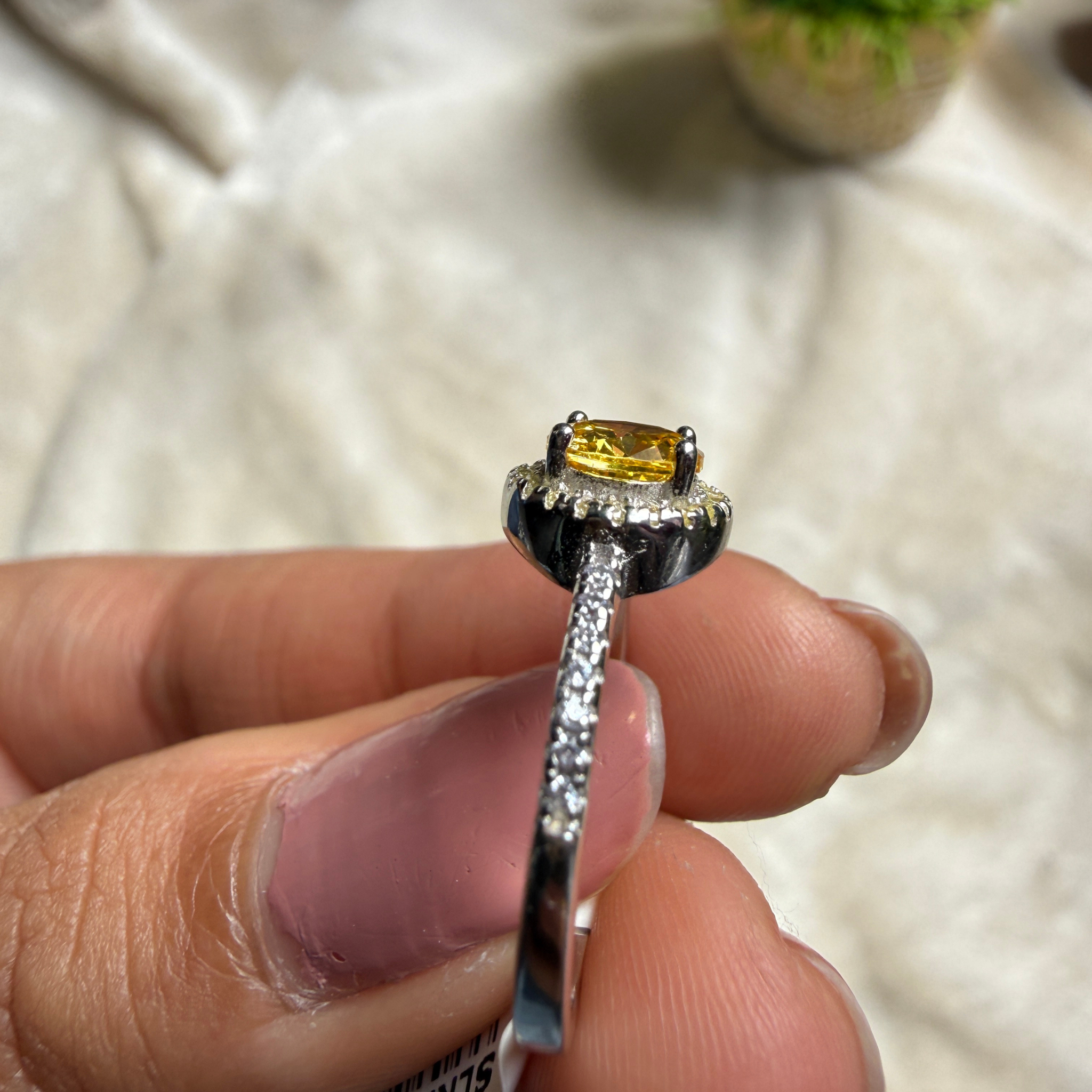 Yellow round gemstone halo ring with lab-grown diamonds by Kiashaa Jewellery.