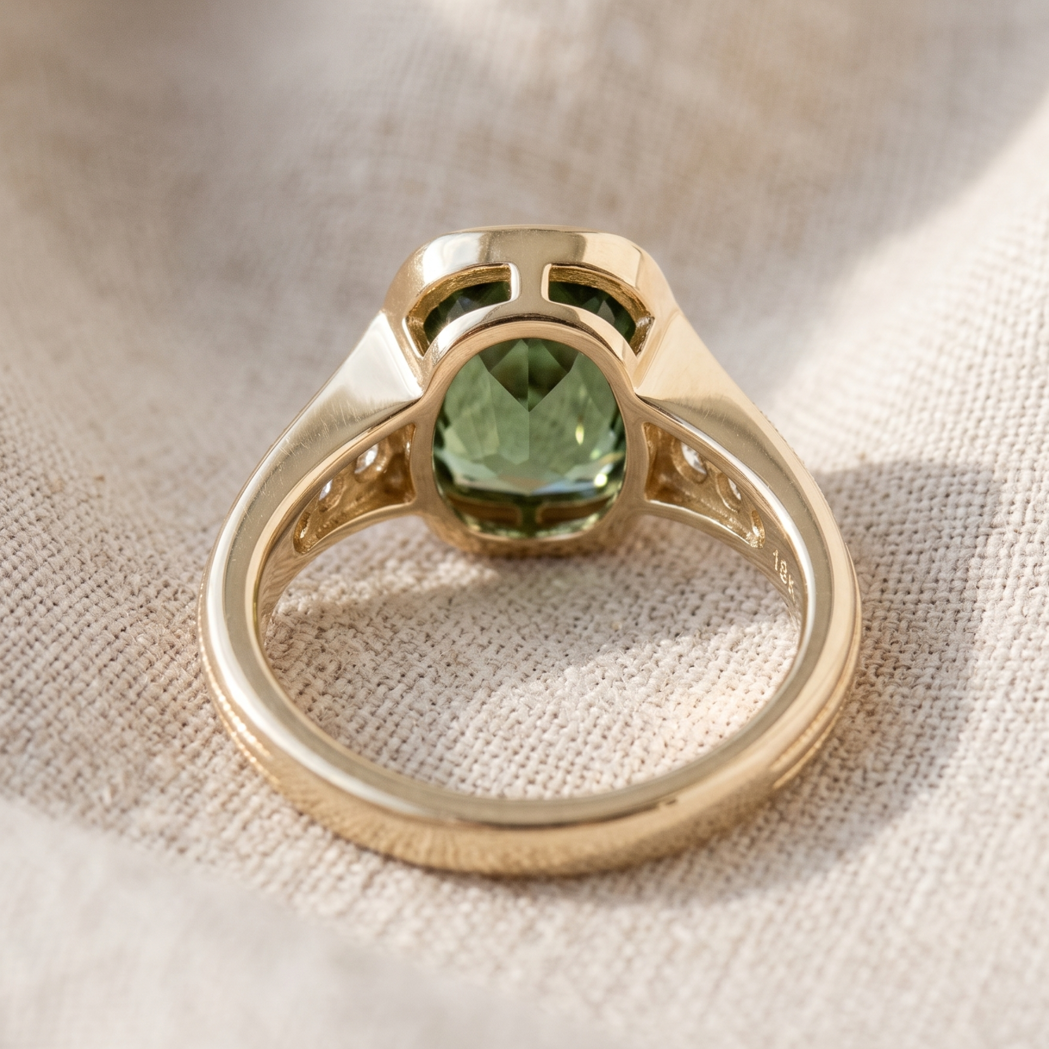 Kiashaa Jewellery green cushion bezel ring with diamond shoulders