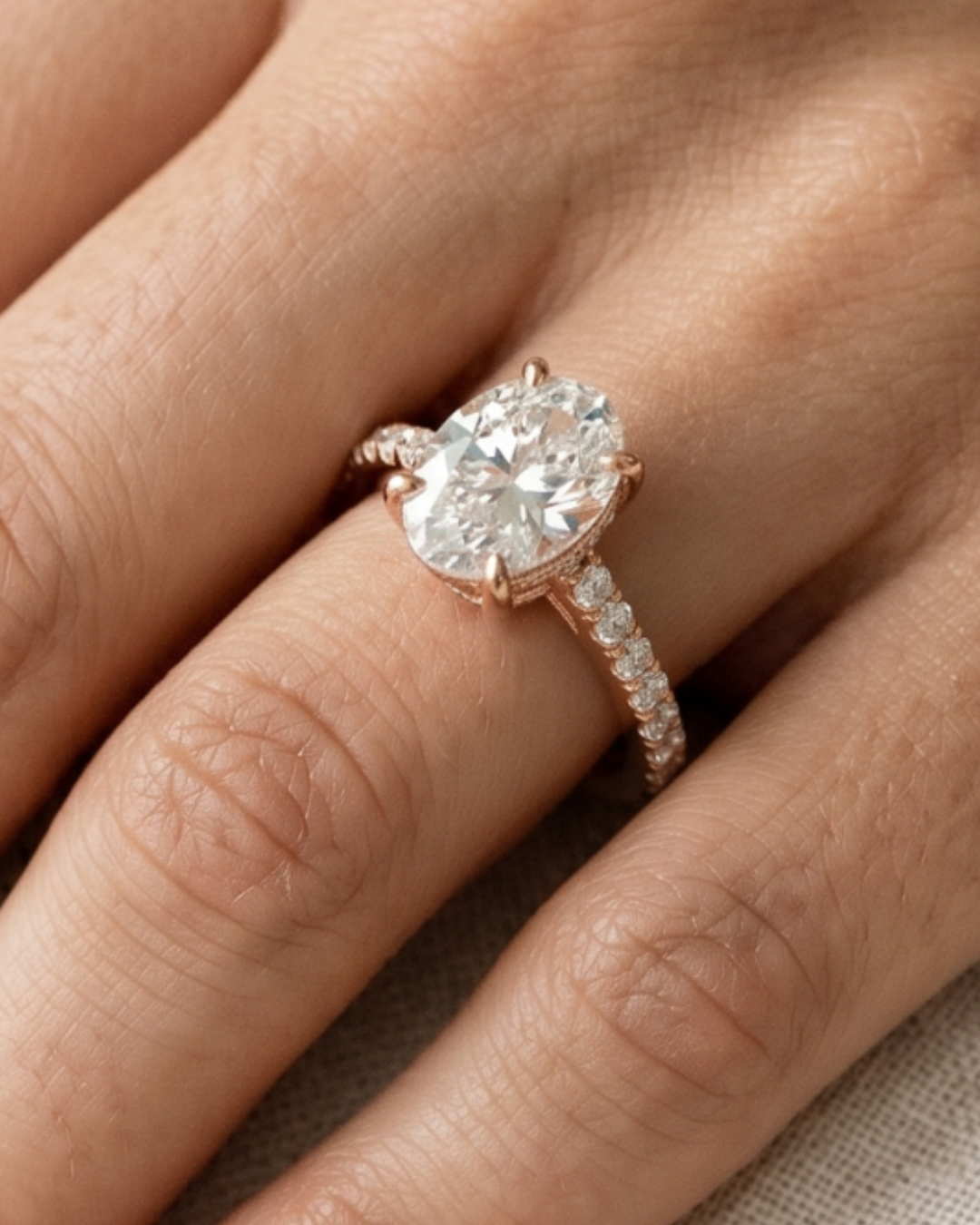 Premium 2.304 carat oval diamond ring by Kiashaa Jewellery with round diamond accents in rose gold.