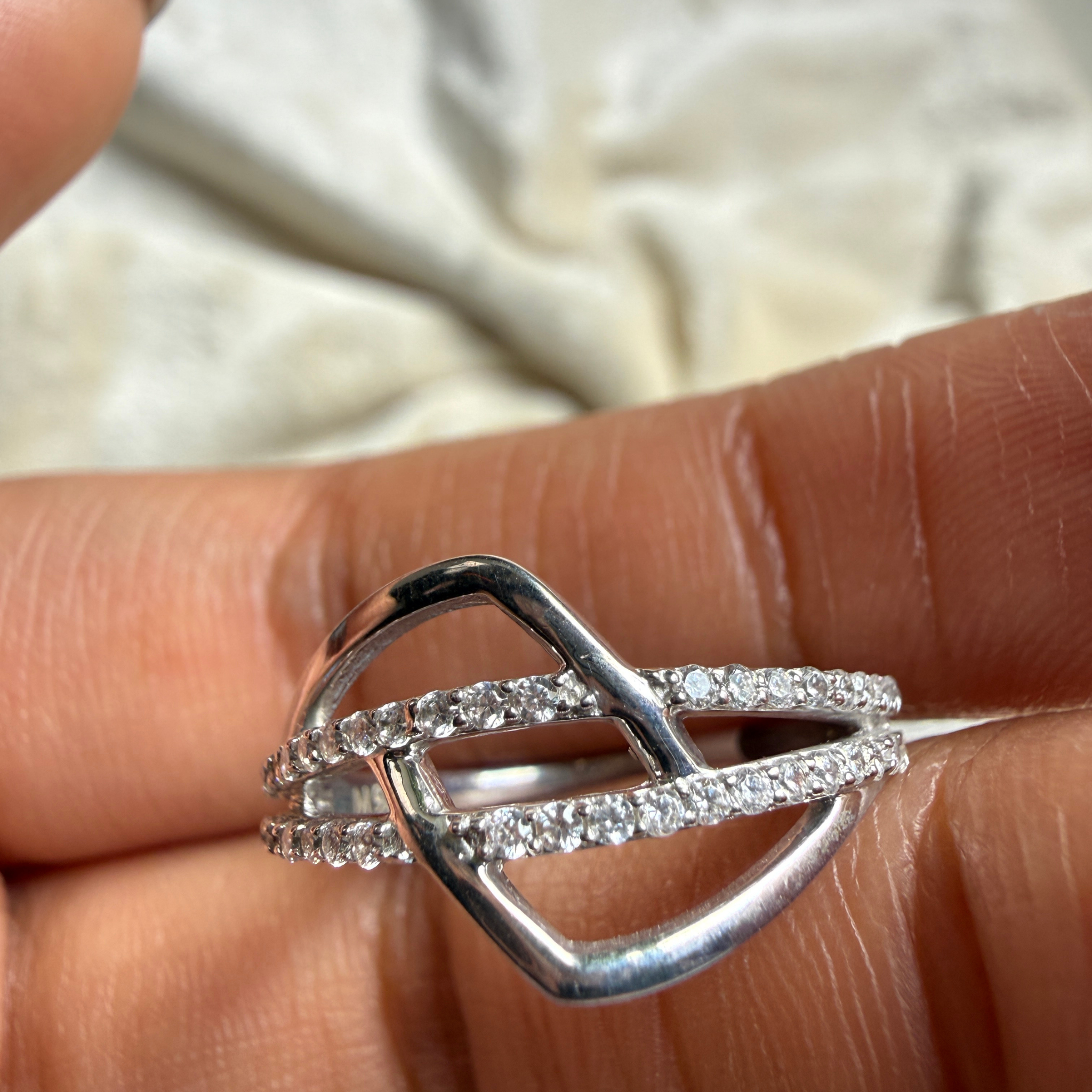 Contemporary open-frame diamond ring handcrafted in 9K, 14K and 18K gold.