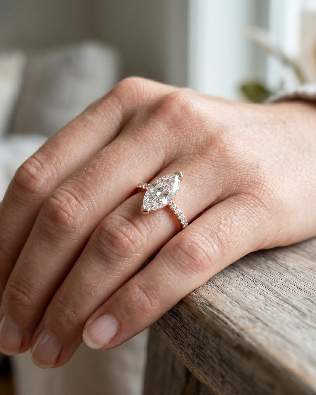 Marquise cut diamond ring with round side stones