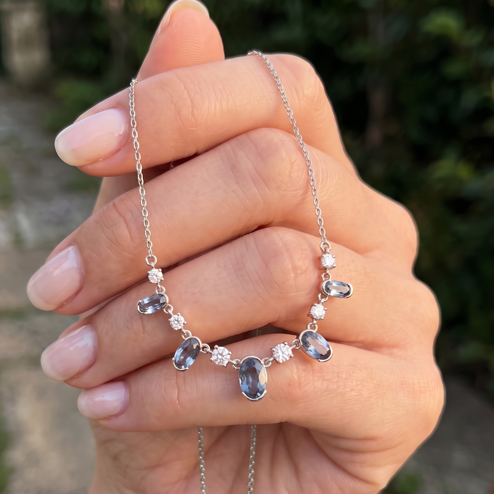 4.20 CTW oval and round diamond station necklace in polished yellow gold.