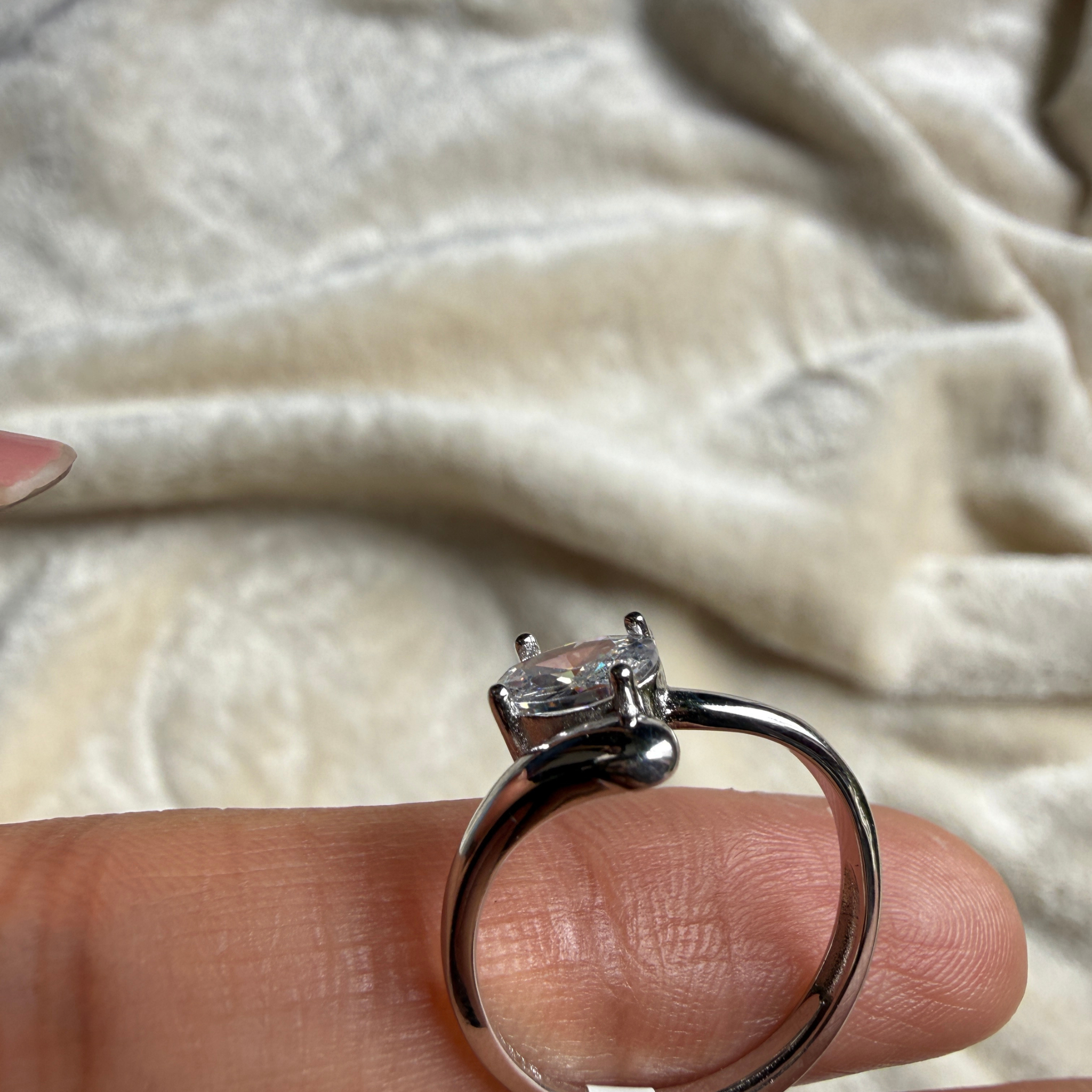 Oval lab-grown diamond bypass solitaire ring in white gold by Kiashaa Jewellery.