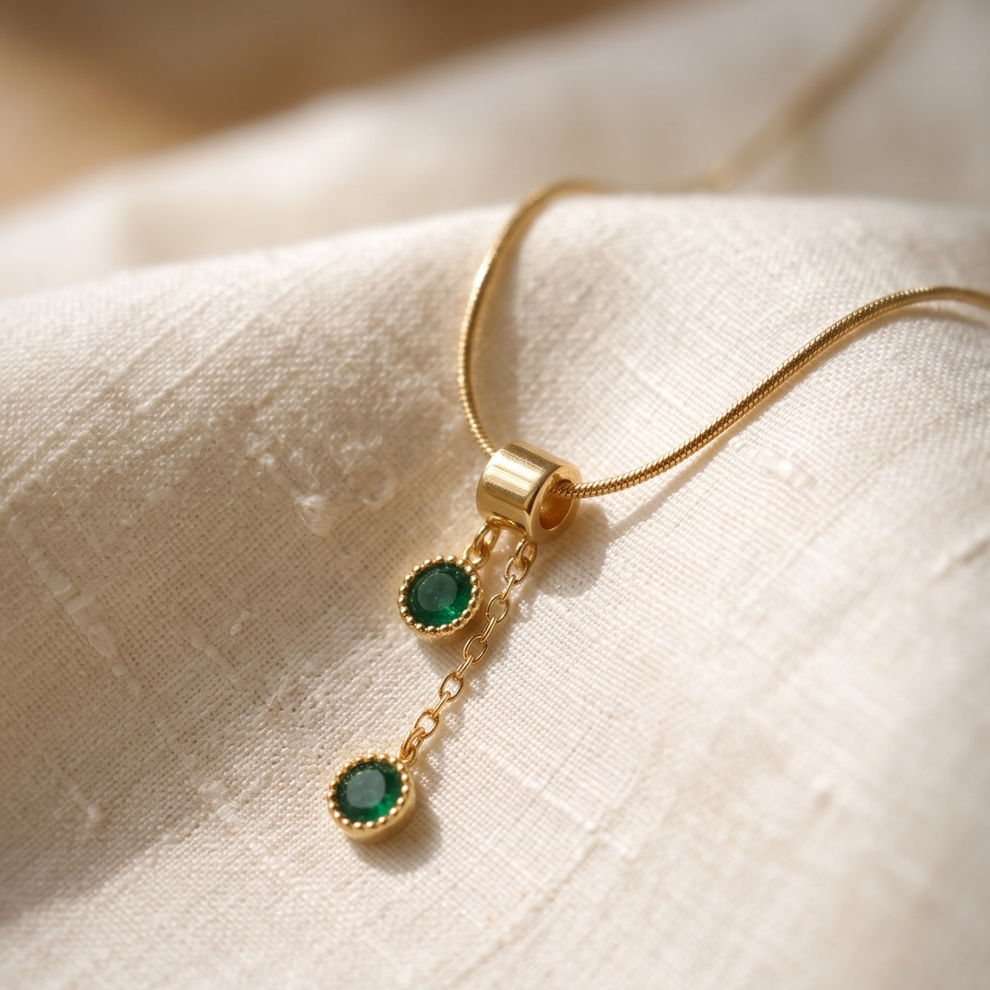  1.50 CTW green round gemstone drop necklace in polished yellow gold.