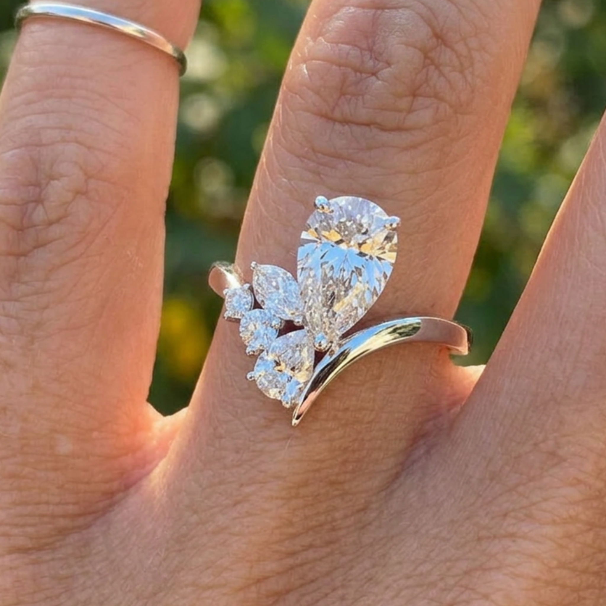 Flora Embrace 3 CTW lab-grown diamond ring by Kiashaa Jewellery with a 2 CT pear center and multi-shape side diamonds.
