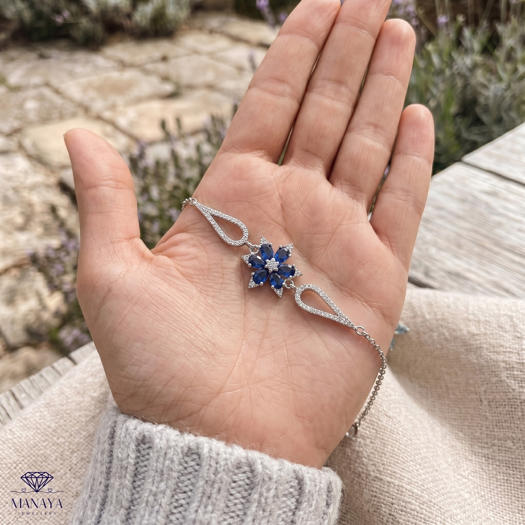 Blue pear gemstone and lab-grown diamond floral bracelet by Kiashaa Jewellery.