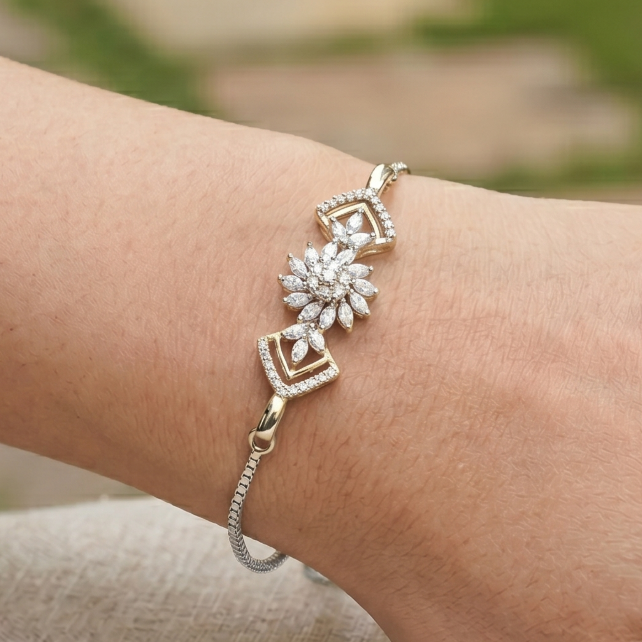 2 CT marquise and round diamond floral bracelet by Kiashaa Jewellery worn on a woman’s wrist.