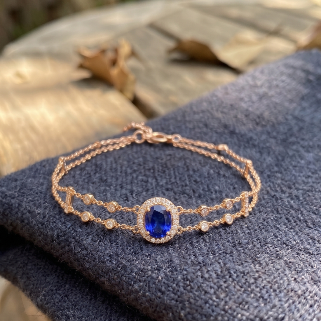 2 CT oval blue sapphire bracelet with diamond halo in yellow gold by Kiashaa Jewellery.