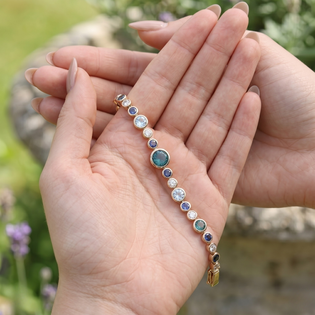 Rainbow bracelet featuring a continuous row of vibrant round gemstones.