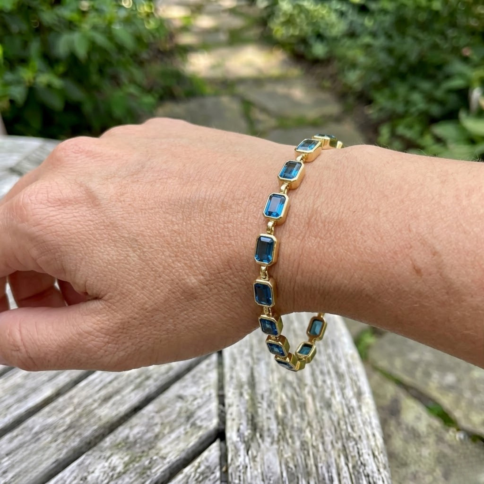 Classic gemstone tennis bracelet available in white, yellow, and rose gold.