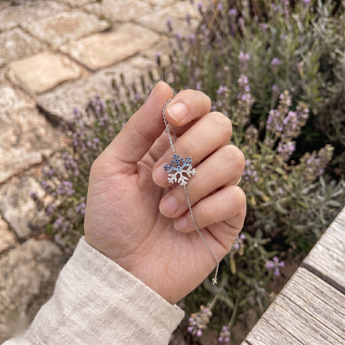Blue gemstone and lab-grown diamond snowflake bracelet by Kiashaa Jewellery.