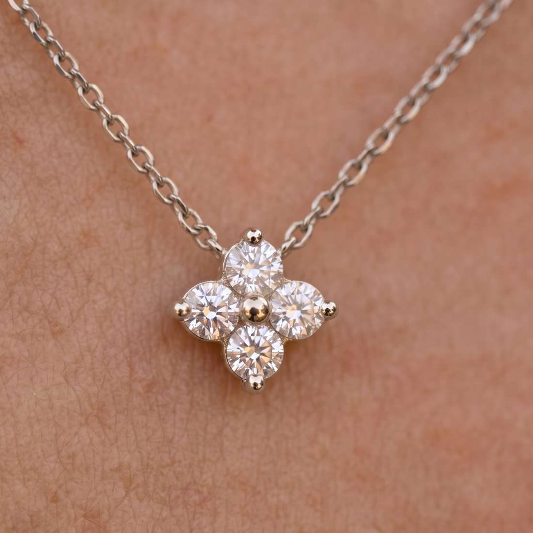 Kiashaa Jewellery 0.14 CTW round diamond flower necklace in polished yellow gold.