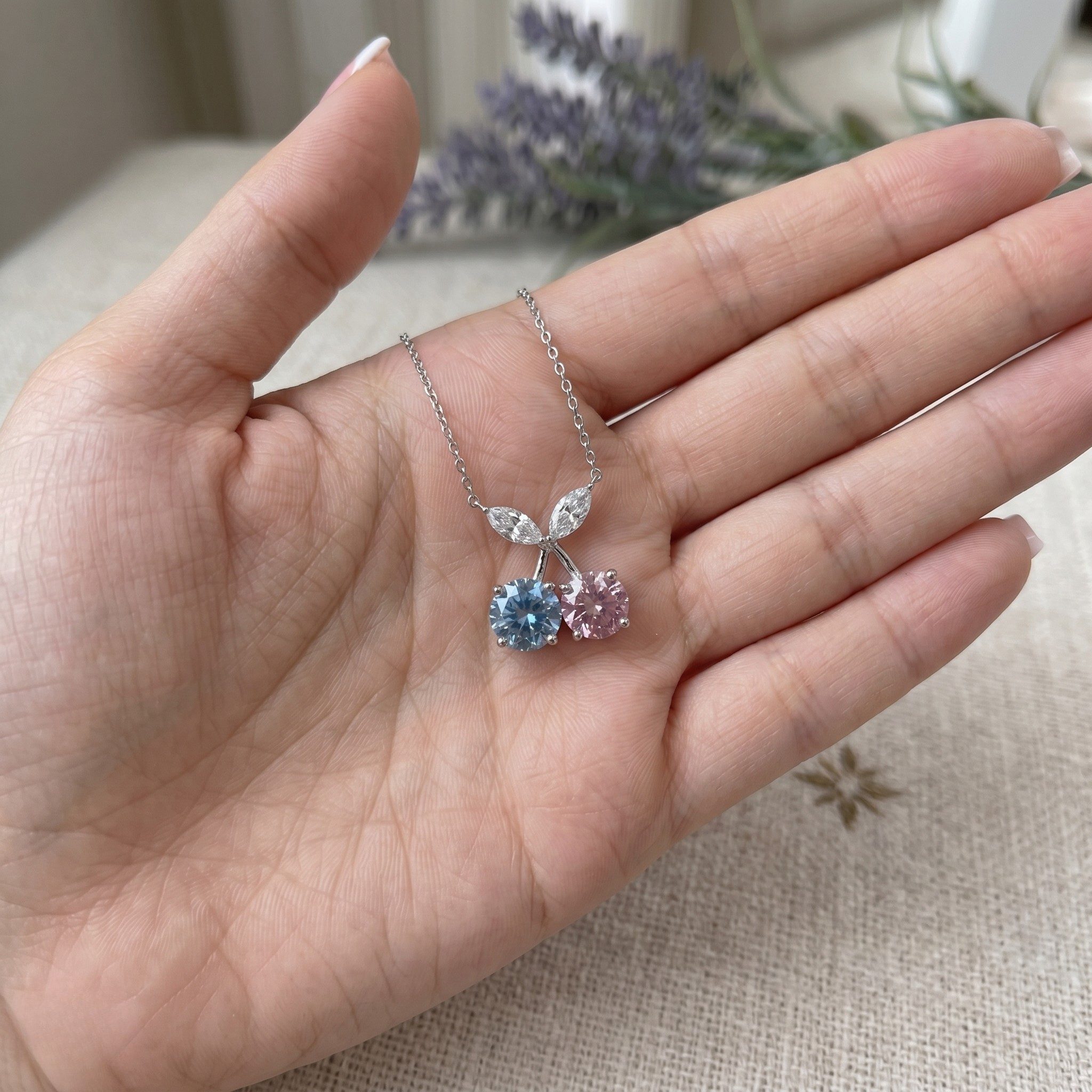 Blue and pink gemstone cherry pendant necklace with marquise lab-grown diamonds by Kiashaa Jewellery.