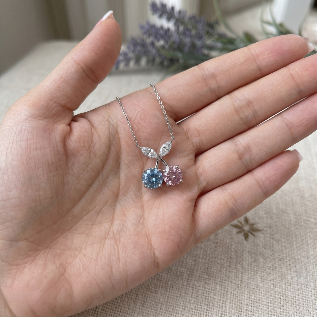Blue and pink gemstone cherry pendant necklace with marquise lab-grown diamonds by Kiashaa Jewellery.