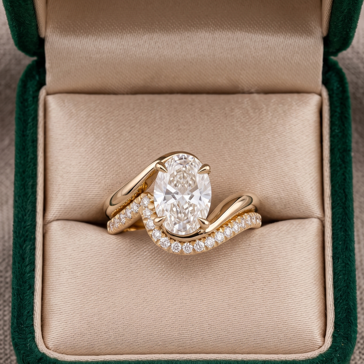 Contemporary oval diamond engagement and wedding ring stack