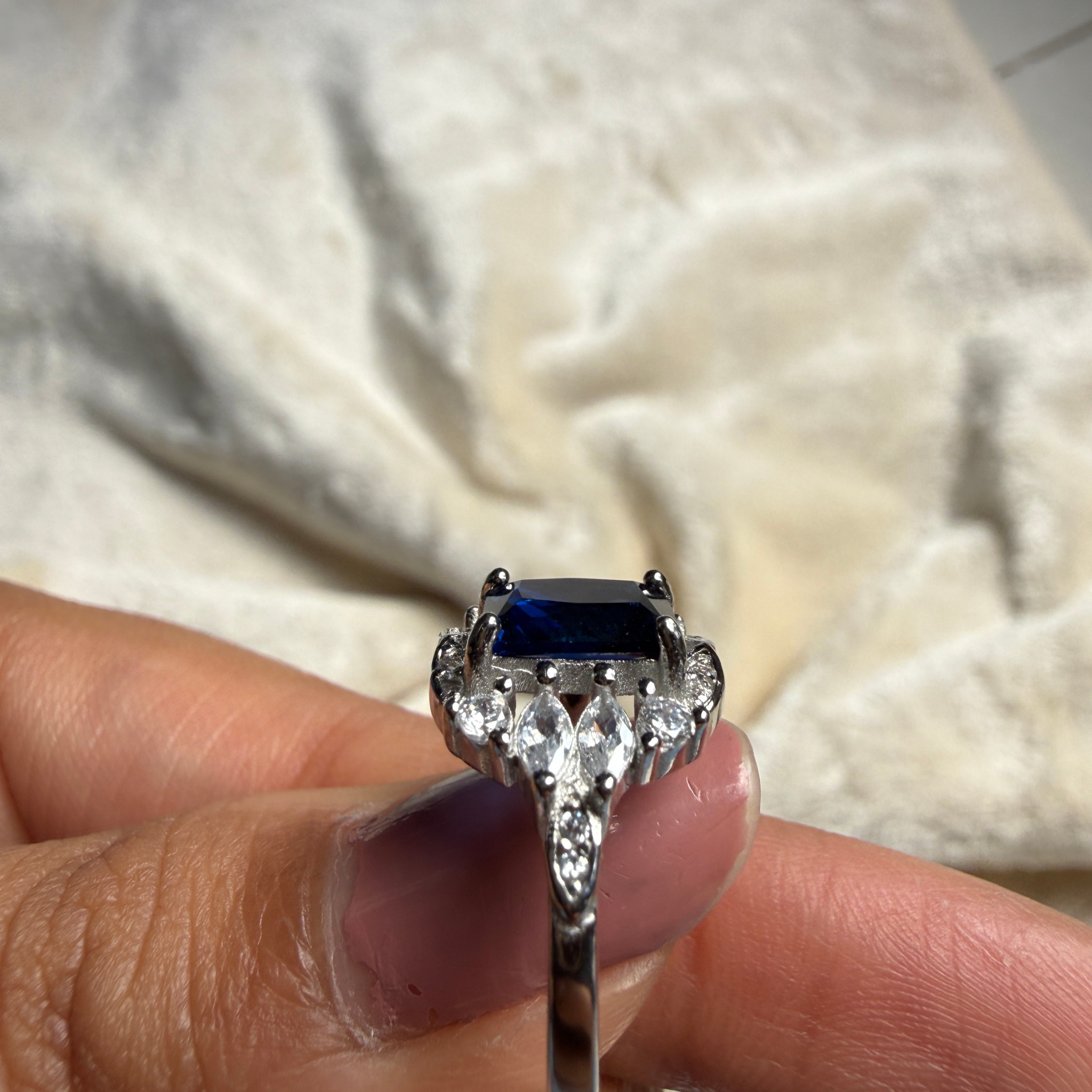 Blue emerald gemstone and lab-grown diamond halo ring by Kiashaa Jewellery.