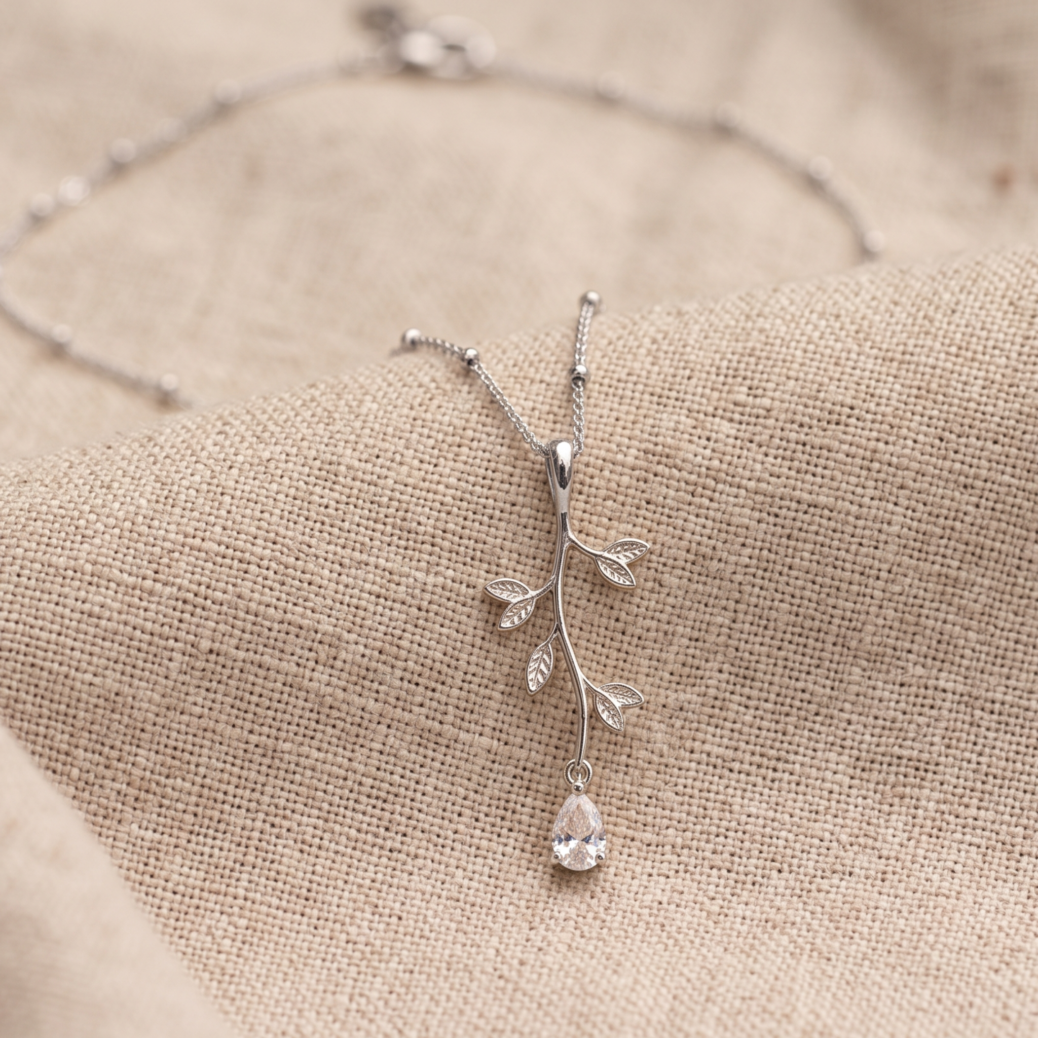 Kiashaa Jewellery 0.39 CT pear diamond leaf pendant necklace in polished yellow gold.