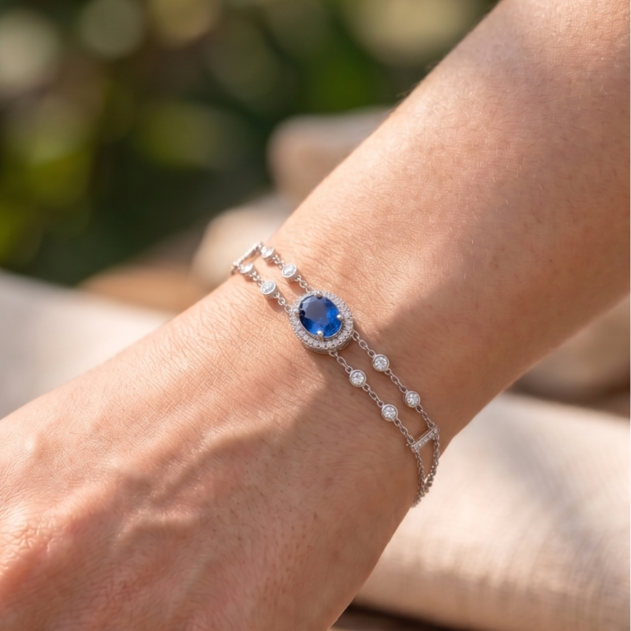 2 CT oval blue sapphire bracelet with diamond halo in yellow gold by Kiashaa Jewellery.