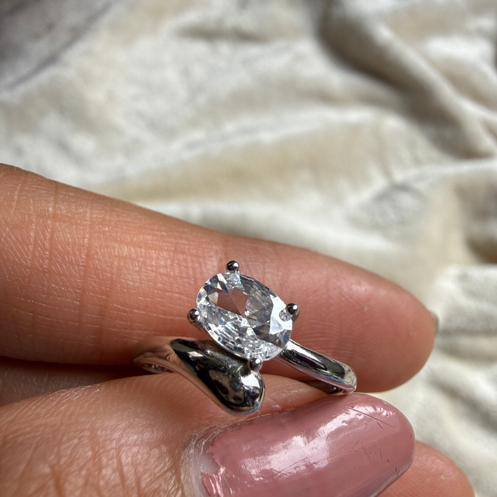 Oval lab-grown diamond bypass solitaire ring in white gold by Kiashaa Jewellery.