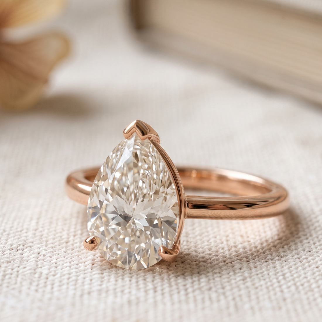 Kiashaa Jewellery 0.76 CT pear solitaire diamond ring in polished yellow gold.