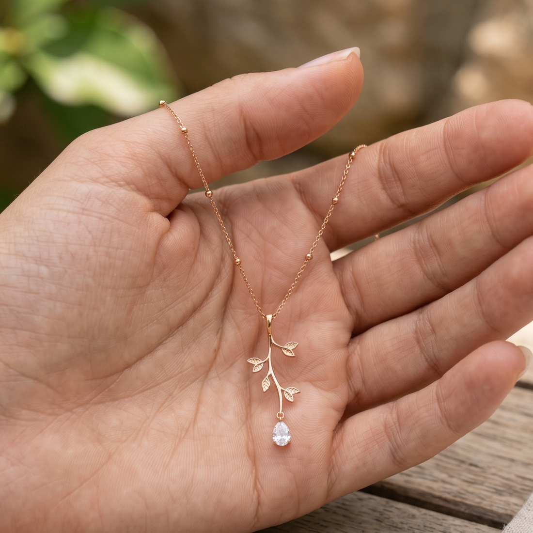 Kiashaa Jewellery 0.39 CT pear diamond leaf pendant necklace in polished yellow gold.