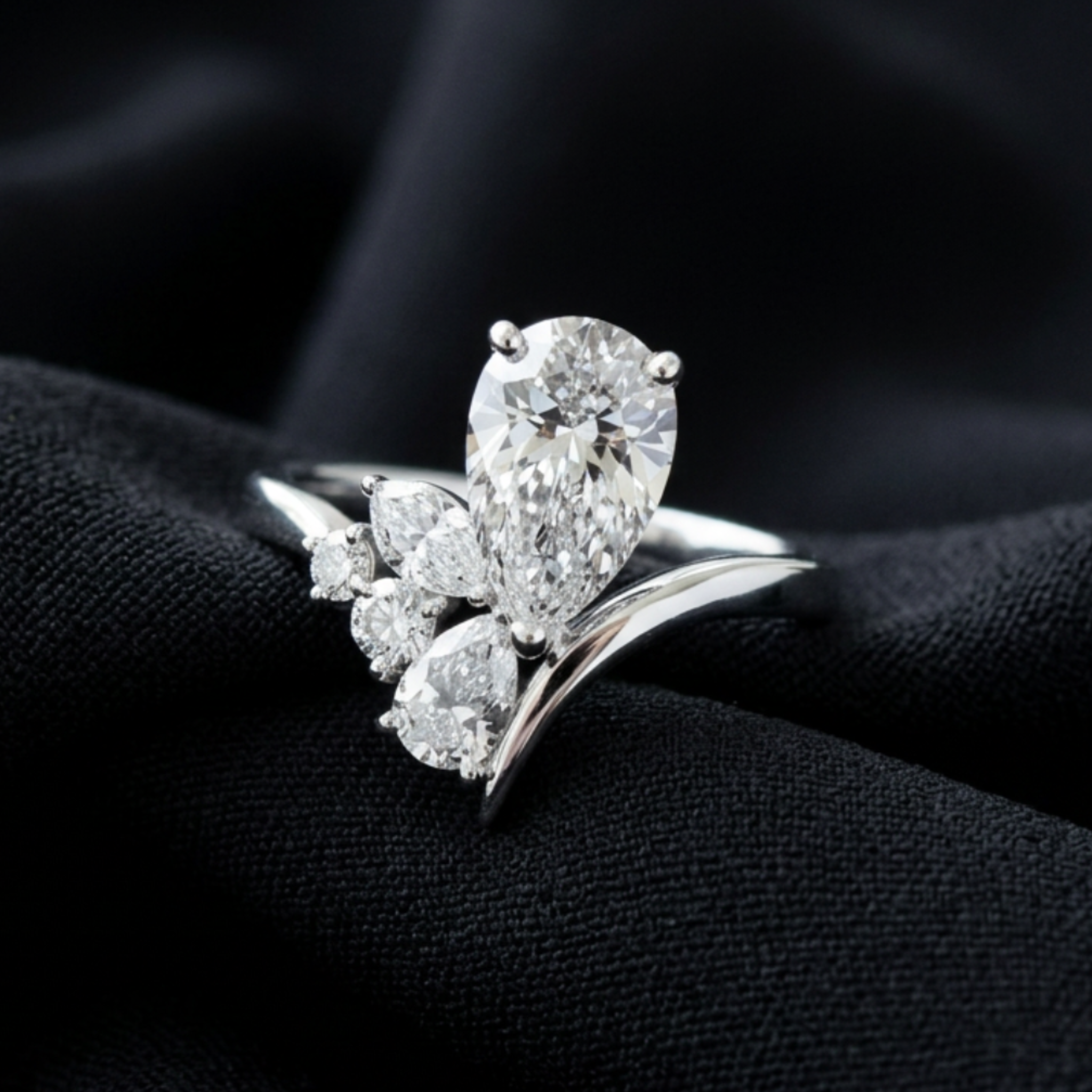 Flora Embrace 3 CTW lab-grown diamond ring by Kiashaa Jewellery with a 2 CT pear center and multi-shape side diamonds.