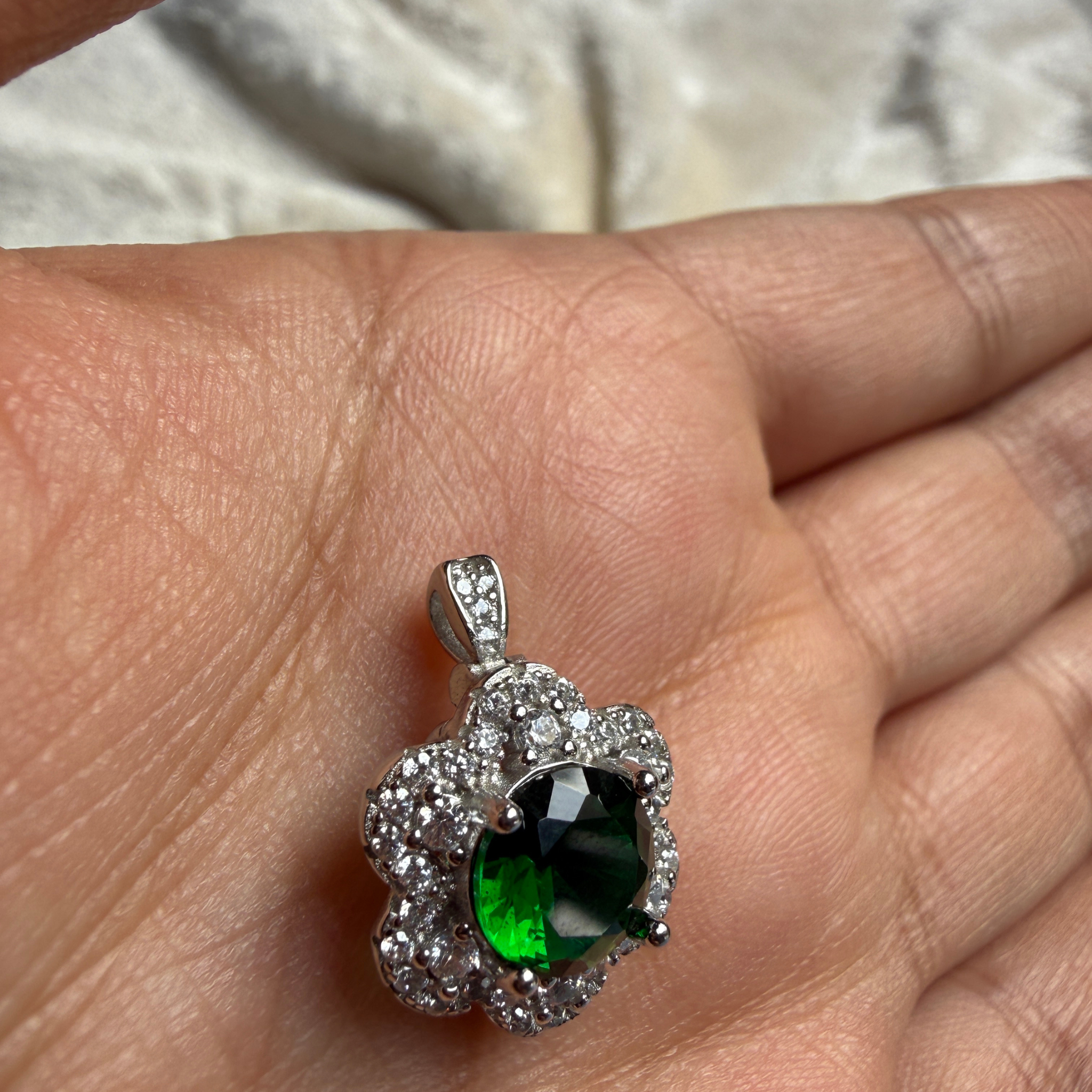 Green gemstone floral halo ring with lab-grown diamonds by Kiashaa Jewellery.