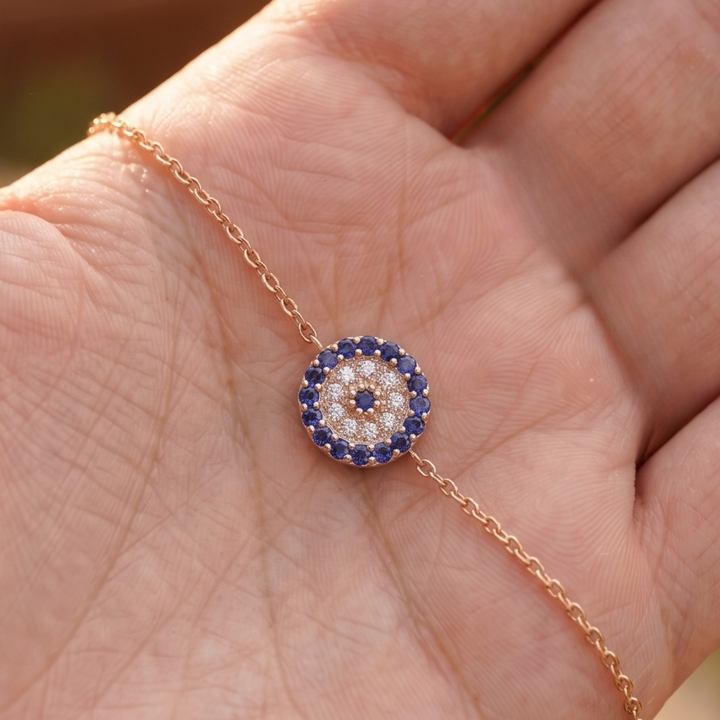 1.00 CT blue gemstone and diamond evil eye bracelet in yellow gold by Kiashaa Jewellery.
