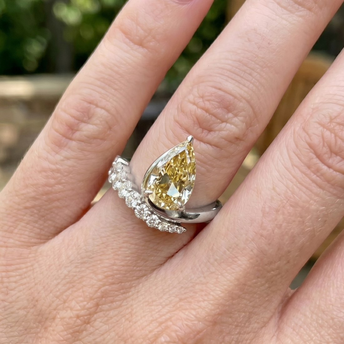 Aurelia 4.50 CTW pear diamond bypass ring by Kiashaa Jewellery featuring a 3 CT pear center diamond in polished yellow gold.