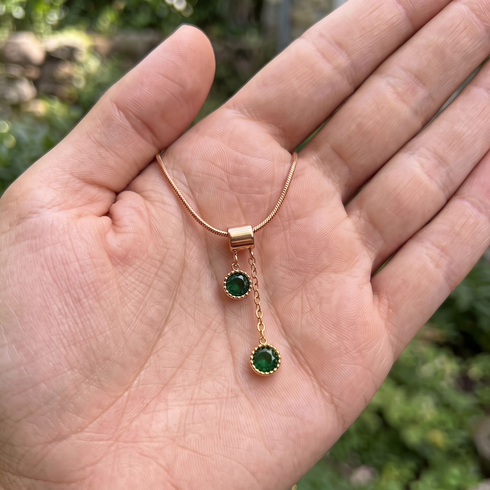  1.50 CTW green round gemstone drop necklace in polished yellow gold.