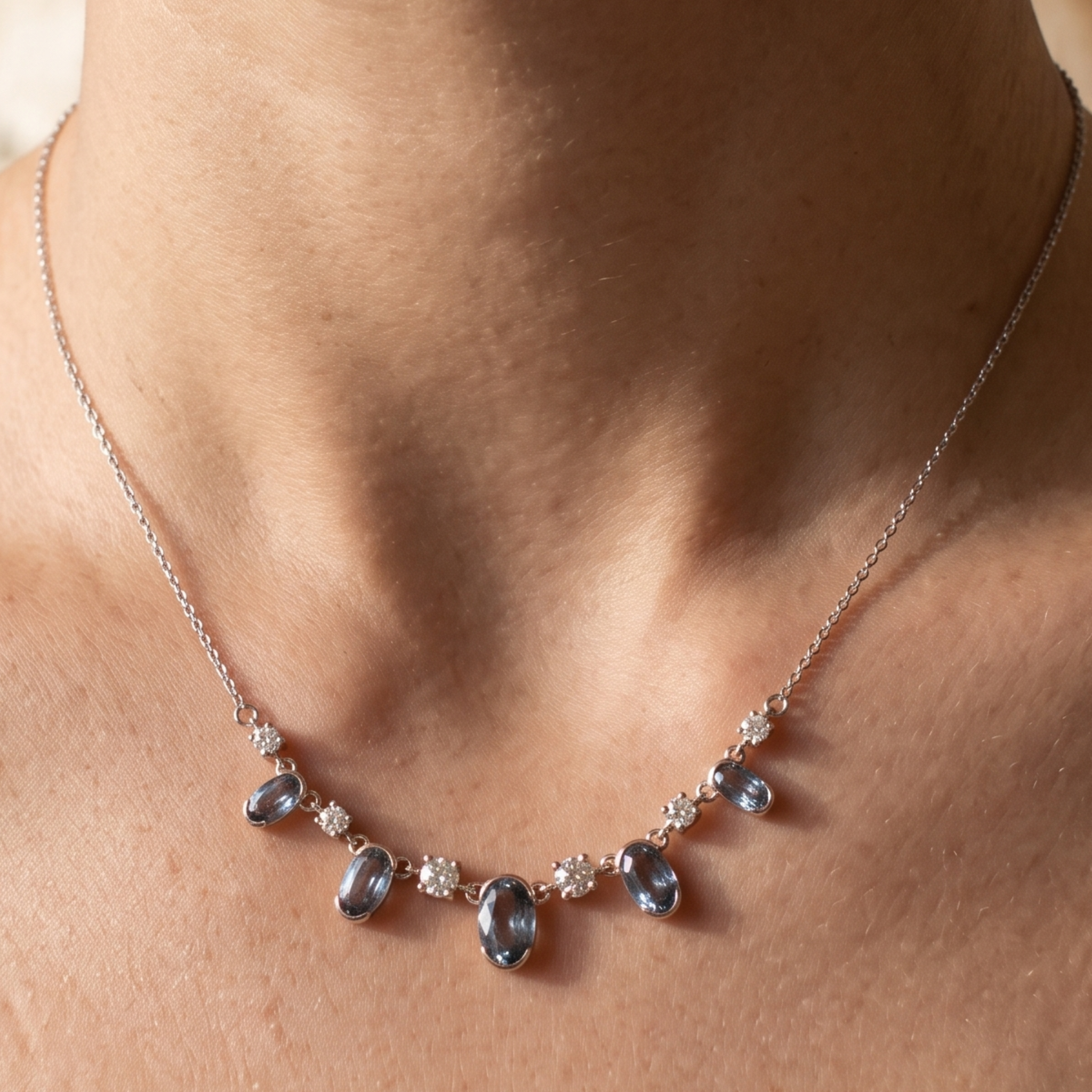 4.20 CTW oval and round diamond station necklace in polished yellow gold.