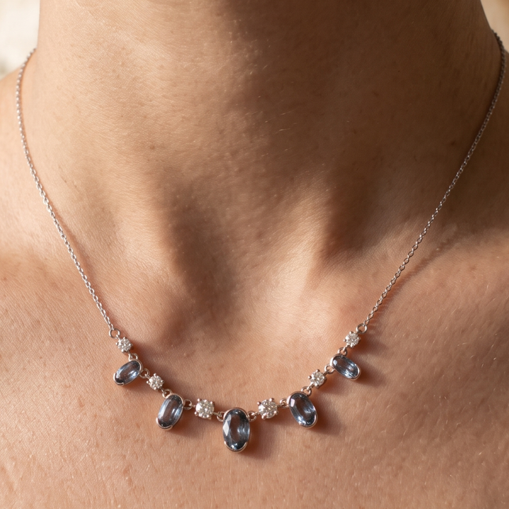 4.20 CTW oval and round diamond station necklace in polished yellow gold.