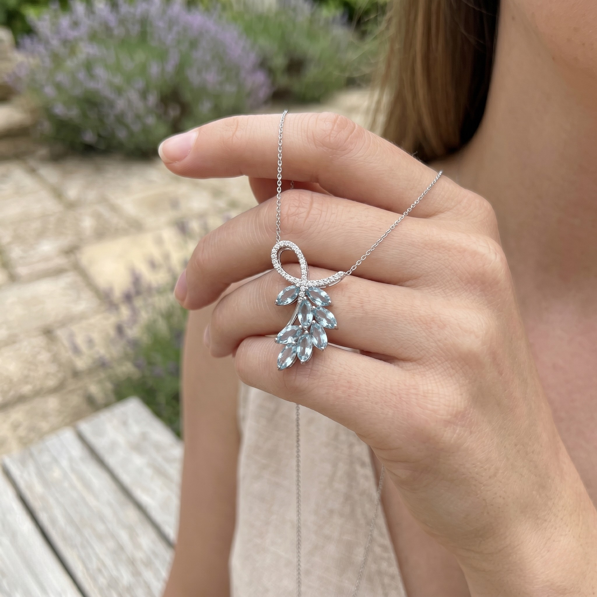 Sky blue marquise gemstone leaf pendant necklace with lab-grown diamonds by Kiashaa Jewellery.