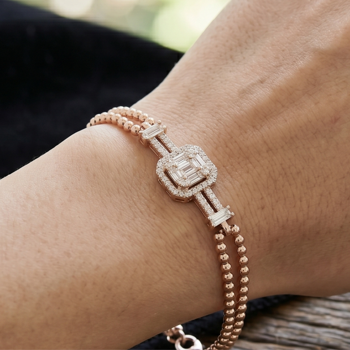 0.60 CT geometric baguette diamond bracelet in rose gold by Kiashaa Jewellery worn on the wrist.