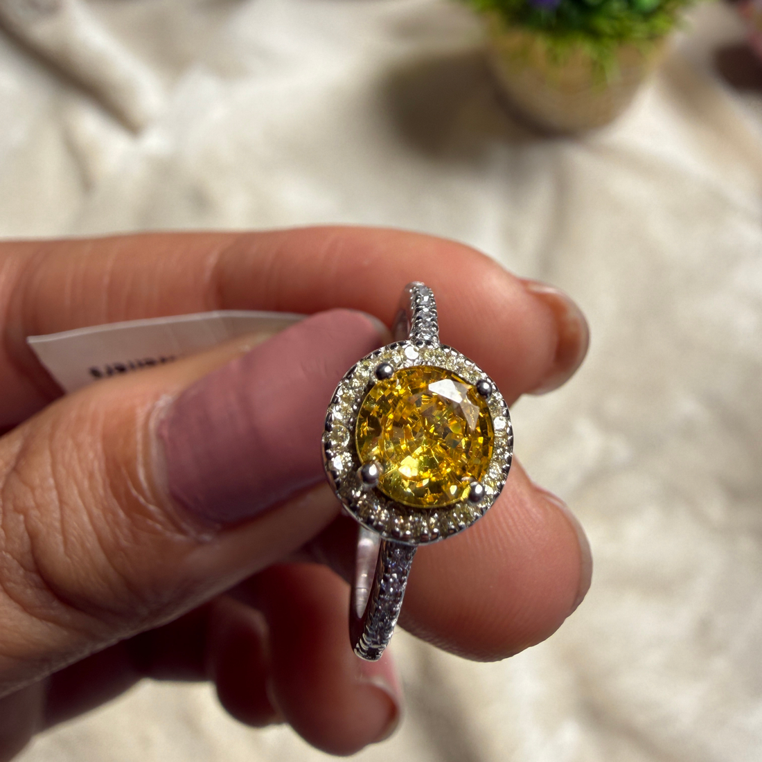 Yellow round gemstone halo ring with lab-grown diamonds by Kiashaa Jewellery.
