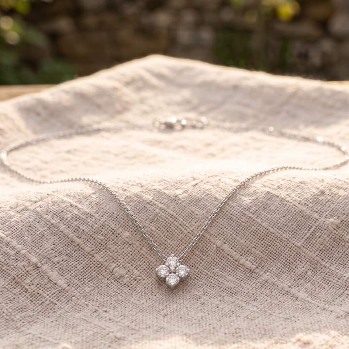 Kiashaa Jewellery 0.14 CTW round diamond flower necklace in polished yellow gold.