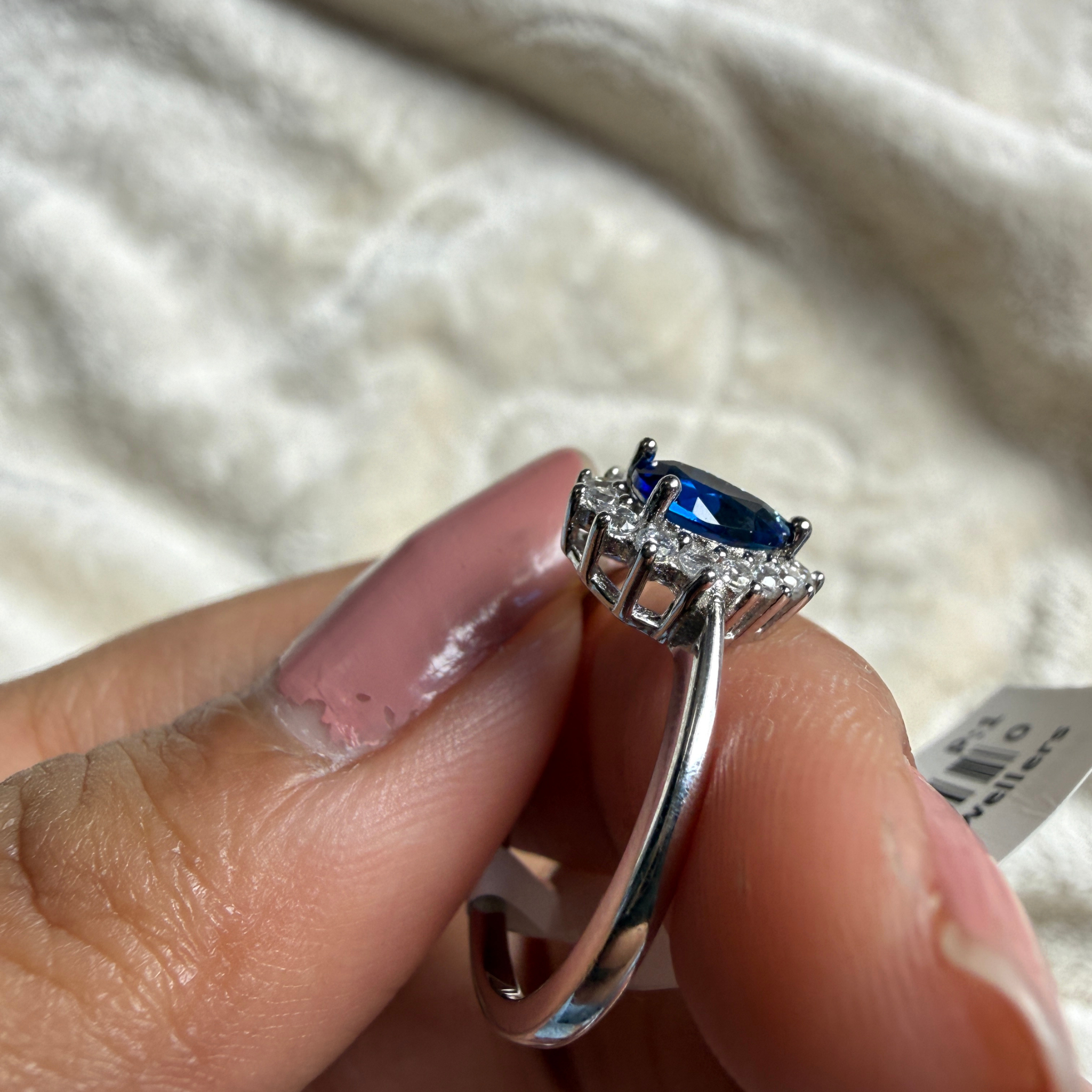 Blue pear gemstone and lab-grown diamond halo ring by Kiashaa Jewellery.