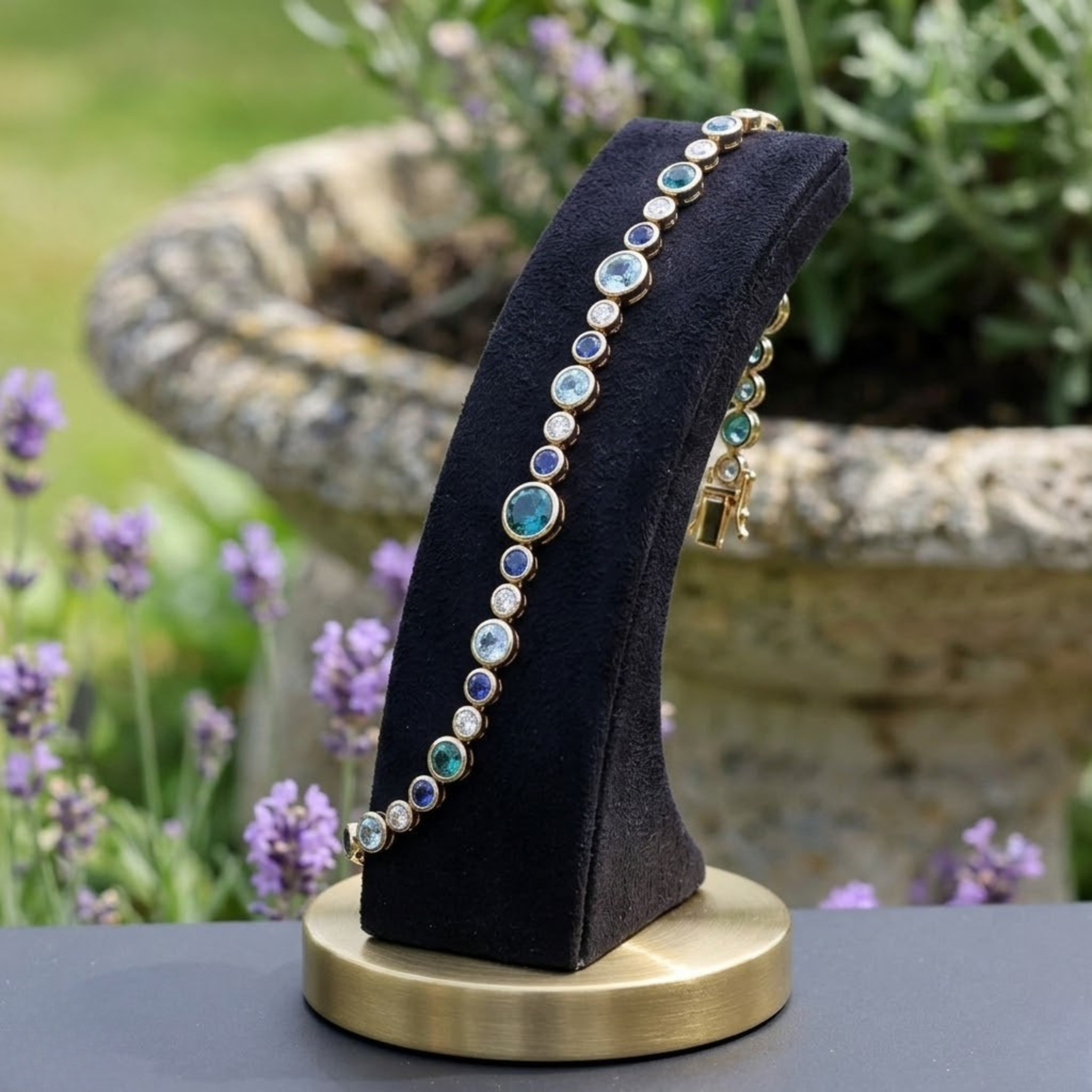 Rainbow bracelet featuring a continuous row of vibrant round gemstones.