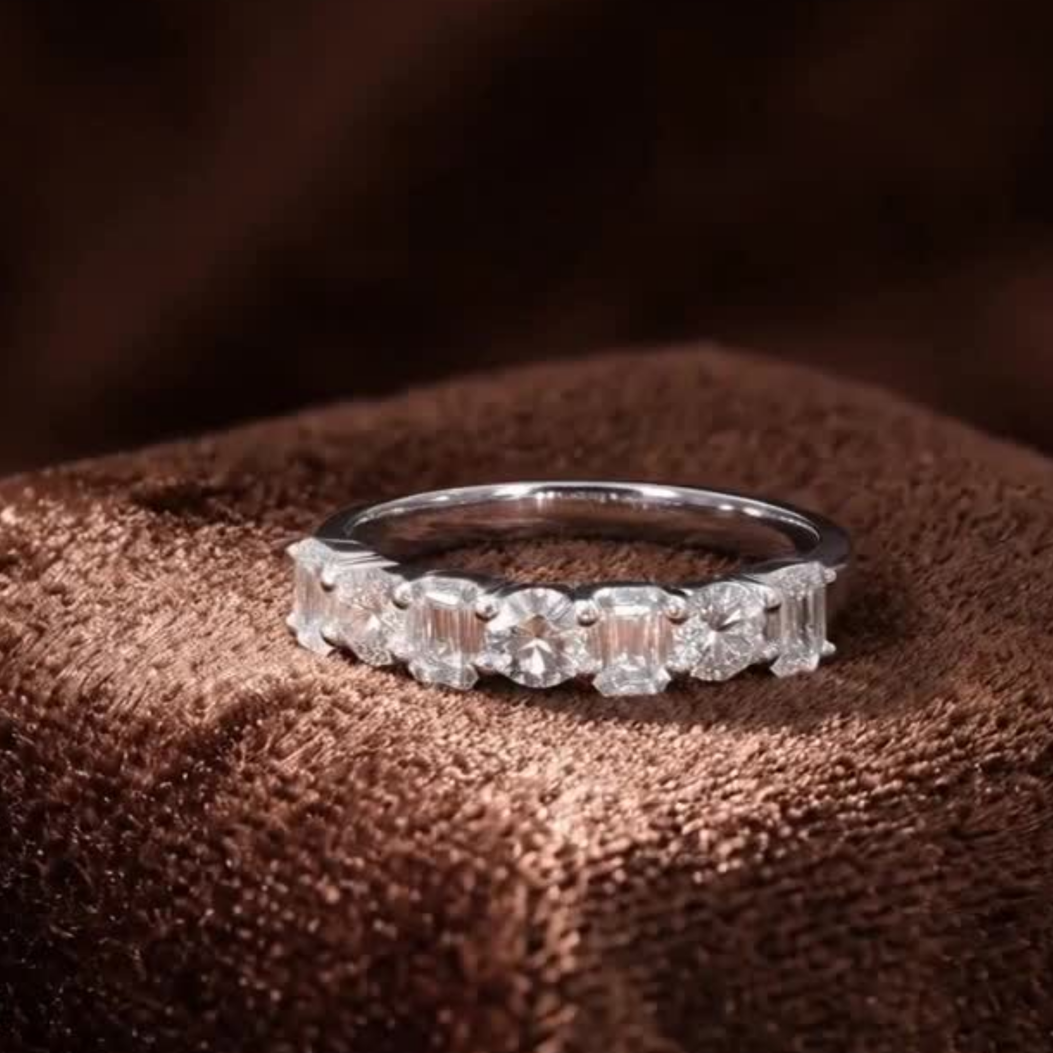 Made-to-order emerald and round diamond anniversary band