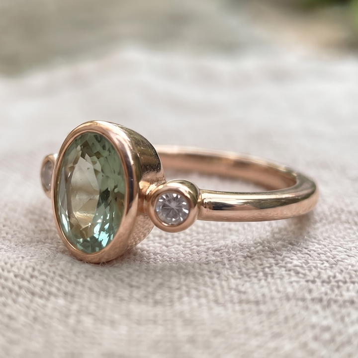 2 CT Oval Green Gemstone Three-Stone Bezel Ring with 0.24 CTW Diamond Accents in 14K & 18K Gold