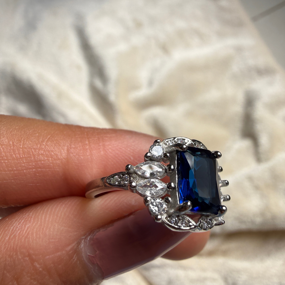 Blue emerald gemstone and lab-grown diamond halo ring by Kiashaa Jewellery.