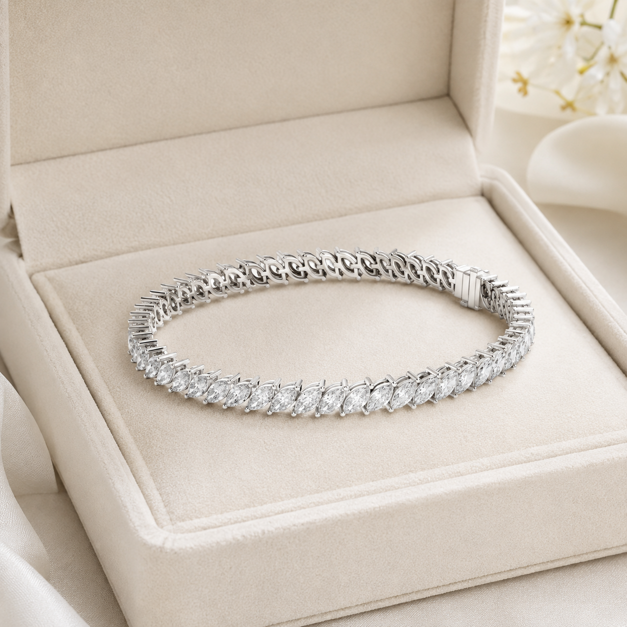 A silver tennis bracelet with a row of clear round-cut stones, displayed inside an open beige jewelry box.