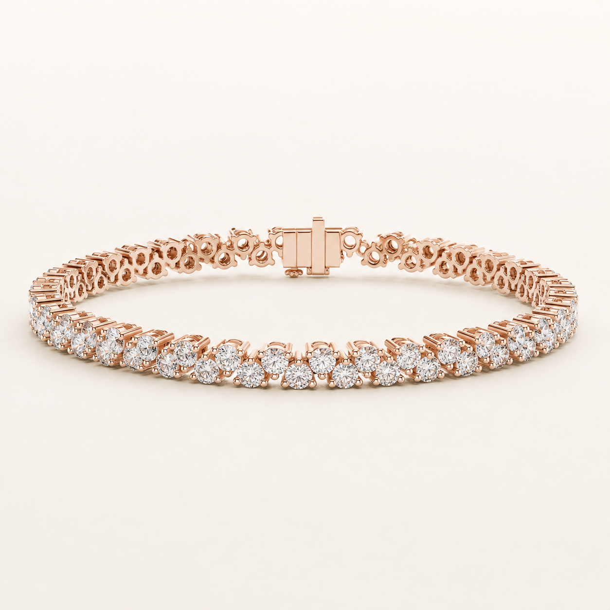 A rose gold tennis bracelet featuring rows of round-cut diamonds, displayed on a clean, light beige background.
