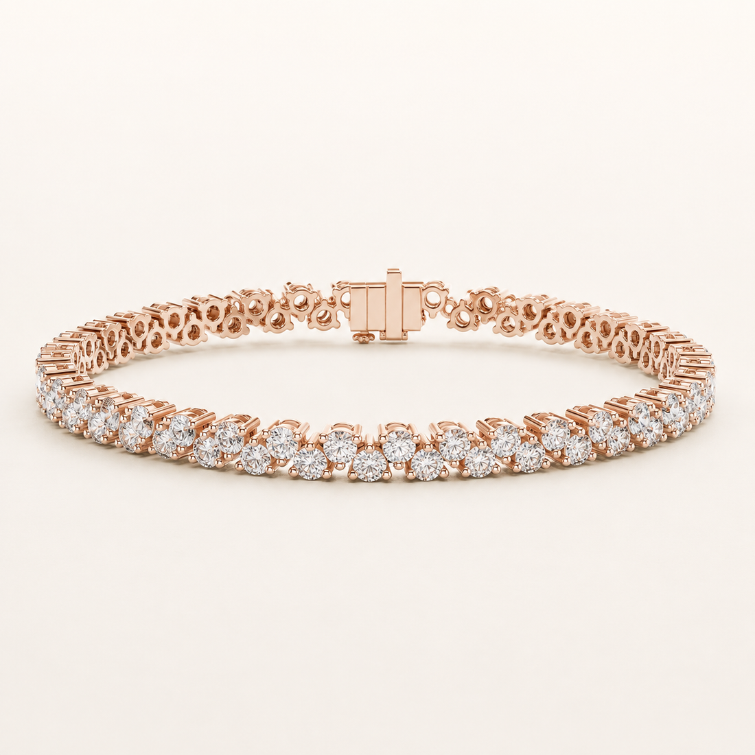 A rose gold tennis bracelet featuring rows of round-cut diamonds, displayed on a clean, light beige background.