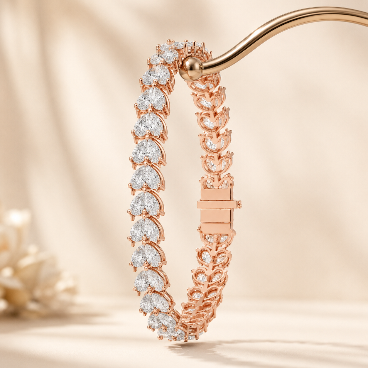 A rose gold bracelet with heart-shaped clear gemstones, held by a gold stand against a warm beige background.